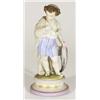 Hand painted Victorian bisque figure of a young boy clutching fish in a shawl, 25cm high