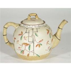 Victorian pottery teapot with simulated bamboo handle and spout, hand painted and relief moulded wit
