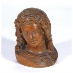 Terracotta bust of a young woman with flowing hair, 20cm high