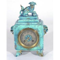 Turquoise glazed Continental chiming pottery mantel clock, modelled with dogs of Foo with enamel dia