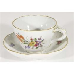 19th century Continental porcelain cup and saucer with branch handle, hand painted with sprigs of fl