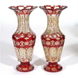 Pair of 19th century cut ruby overlay glass vases, gilded with swags, 27cm high