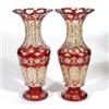 Image 1 : Pair of 19th century cut ruby overlay glass vases, gilded with swags, 27cm high