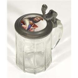 Clear glass tankard with pewter mount, inset with a ceramic lozenge, hand painted with a gentleman,