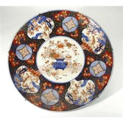Large 19th century Japanese Imari charger, hand painted and gilded with a central panel of flowers i