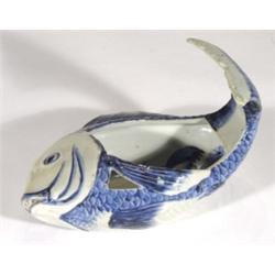 Chinese pottery fish shaped dish, painted in blues, the interior decorated with storks, 25cm in leng