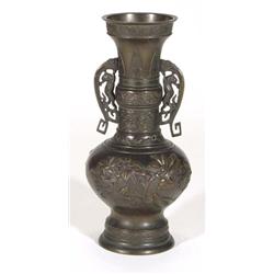 Japanese twin handled bronze vase, moulded with birds amongst trees, 29cm high