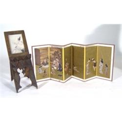 Japanese six section miniature screen, printed with family scenes onto a gilt ground and an oriental