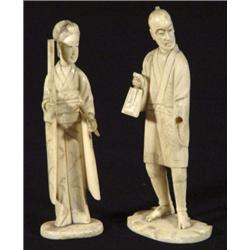 Pair of carved ivory figures, a lady and gentleman clutching implements, 13cm high