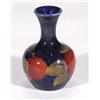 Image 1 : Miniature Moorcroft baluster vase, hand painted and tubelined with 'Pomegranate' pattern onto a dark