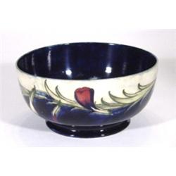 Moorcroft pottery bowl, hand painted and tubelined with a pansy to interior and a band of pansies to