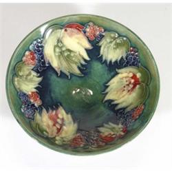Small Moorcroft pedestal bowl, hand painted and tubelined with leaves and berries, impressed marks a