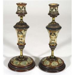 Pair of Doulton Lambeth stoneware candlesticks by Frank Butler on brass stems with incised decoratio