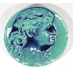 Turquoise glazed Burmantofts faience wall plate, decorated with a young girl, signed P. Mallet, impr