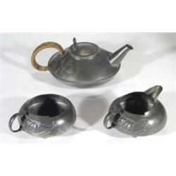 Three piece Libertys Art Nouveau pewter teaset, designed by Archibald Knox, embossed with stylised m