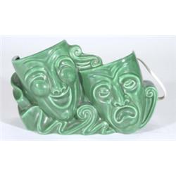 Green glazed Art Deco pottery table lamp modelled as Ecstasy and Tragedy masks, 26cm in length