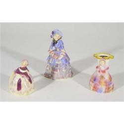 Two hand painted Carltonware crinoline lady napkin rings and a Carltonware crinoline figurine, marks