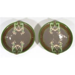 Two Eichwald plates, relief moulded and hand painted with floral swags onto a grey, green and brown