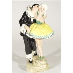 Hand painted Art Deco Czechoslovakian figure group, Pierrot whispering to a young dancer, marks to b