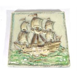Karlsruhe pottery plaque depicting an Arts and Crafts style galleon amongst waves, impressed mark to