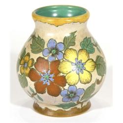 Gouda pottery vase, hand painted with flowers onto a brown ground, marks to base, 17cm high