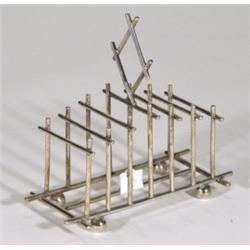 Silver plated Christopher Dresser style six slice toastrack on globular feet, 18cm high