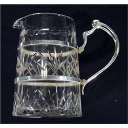 Cut glass water jug with aesthetic Christopher Dresser style silver plated mount and handle, 17cm hi