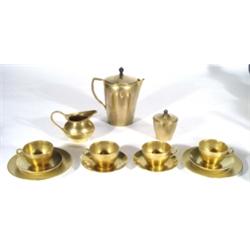 Was Benson brass three piece teaset with wicker handle and ebony knop, comprising teapot, milk jug a