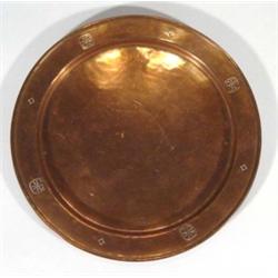 Birmingham Guild Arts and Craftscircular copper dish, embossed with stylised decoration, marks to ba