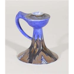 Hand painted Clews Chameleonware chamberstick, decorated with a brown flame pattern onto a mottled b