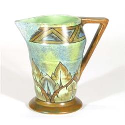 Art Deco stepped jug with angular handle with a brown flame pattern onto a mottled green and blue gr