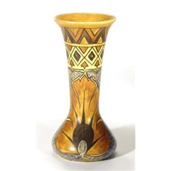Hand painted Clews Chameleonware vase, decorated with a brown peacock feather onto a mottled blue an