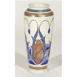 Hand painted Clews Chameleonware vase, decorated with blue, brown and green leaves onto a brown spot