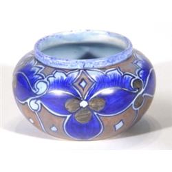 Hand painted Clews Chameleonware squat vase, decorated with blue flowers onto a mottled brown and bl