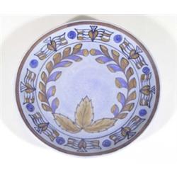 Hand painted Clews Chameleonware plate, decorated with brown and blue leaves onto a mottled blue gro