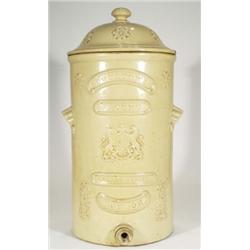 Large Doulton stoneware patent carbon filter, relief moulded with armorial crest and flowers, 65cm h