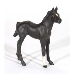 Hand painted Royal Doulton matt black glazed foal, marks to base, 15cm high