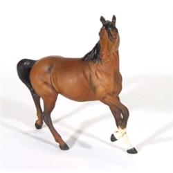 Hand painted Royal Doulton matt glazed brown and black horse, marks to base, 23cm high