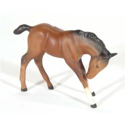 Hand painted Royal Doulton matt glazed brown and black foal, marks to base, 12cm high