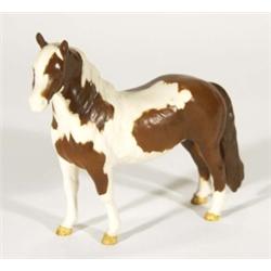 Hand painted Beswick matt glazed brown and white horse with tan feet, marks to base, 18cm high