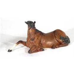 Hand painted Beswick matt glazed resting brown and black horse, marks to base, 13cm high