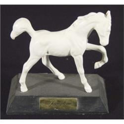 White glazed Beswick 'Springtime Foal' on a black base, marks to base, 14cm high