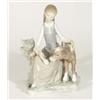 Hand painted Lladro figurine of a young girl feeding a calf, marks to base, 22cm high