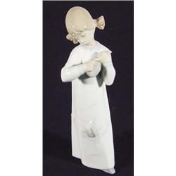 Boxed hand painted Lladro girl playing a violin, marks to base, 22cm high