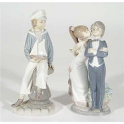 Hand painted Lladro figure of a boy in a sailor suit and one other of a bride and groom, marks to ba