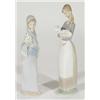 Hand painted Lladro figure of a girl clutching a lamb and one other of a girl in a shawl with flower