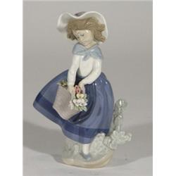 Hand painted Lladro figurine of a girl with flowers, marks to base, 18cm high