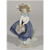 Hand painted Lladro figurine of a girl with flowers, marks to base, 18cm high
