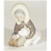 Hand painted Lladro figure of a young eskimo playing with a polar bear cub, marks to base, 12cm high
