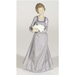 Hand painted Nao figurine clutching a rabbit, marks to base, 26cm high